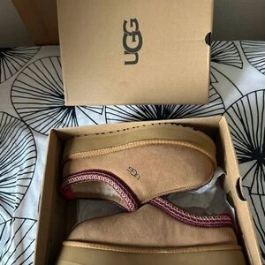 UGG Classic Tan Slippers with Red Accent